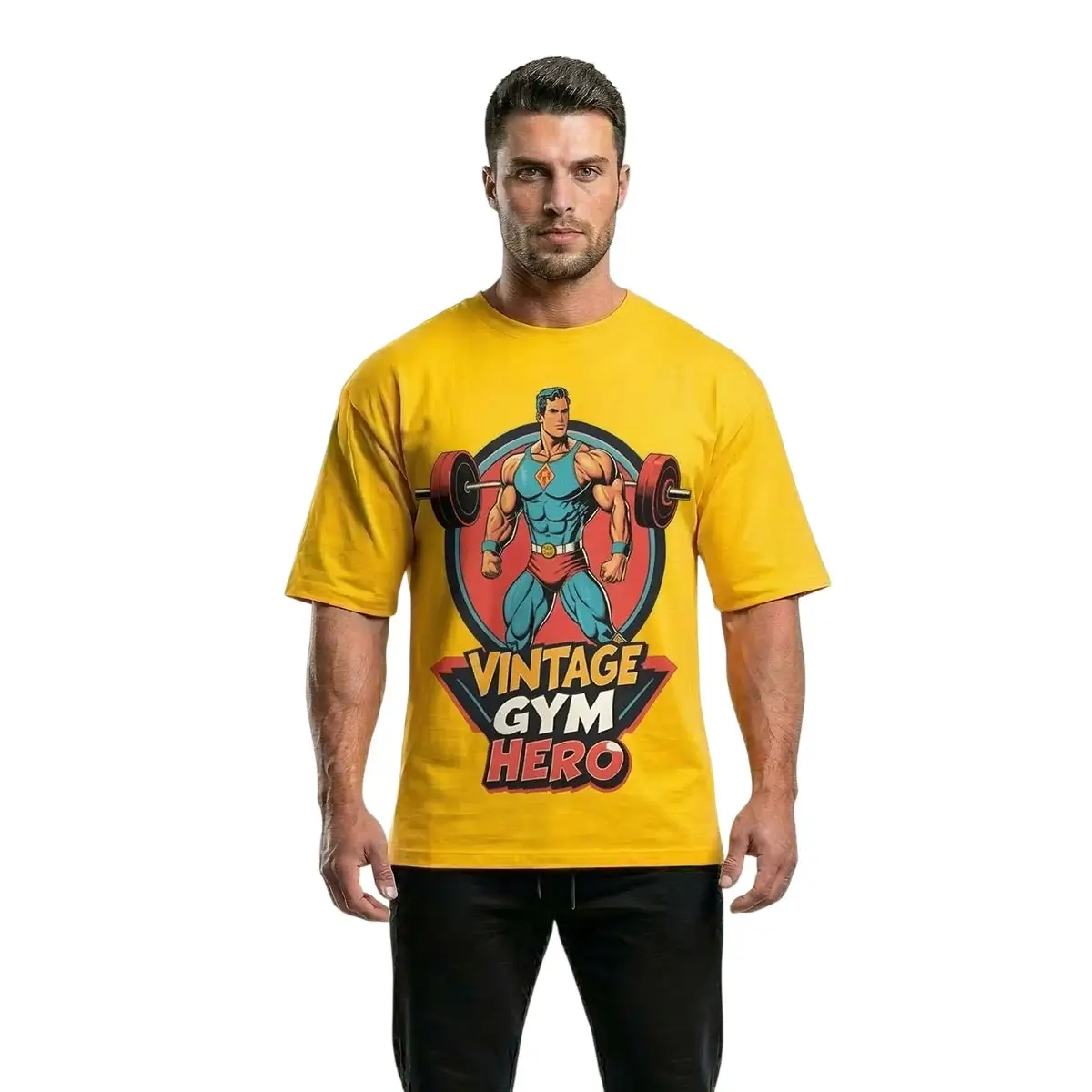 A frontal photograph of a fit male model wearing a premium sun yellow oversized t-shirt with a vintage comic art graphic of a retro hero lifting a barbell and the text 'VINTAGE GYM HERO', isolated against a white background.
